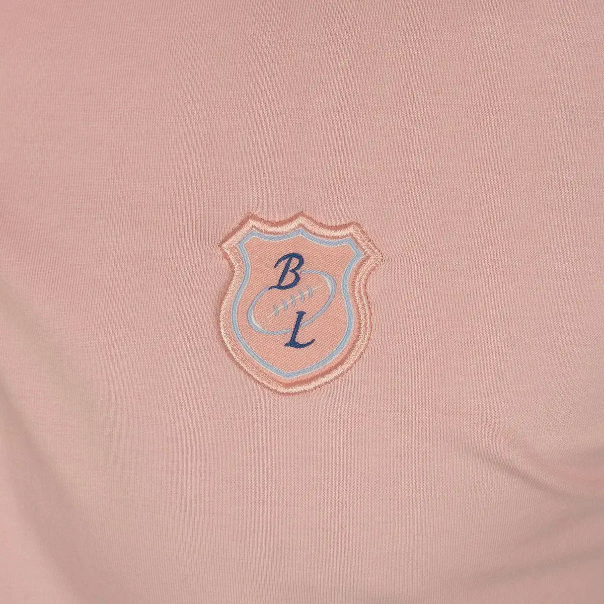 Polo homme rose pâle en jersey élasthanne Blacks Legend (zoom blason brodé)