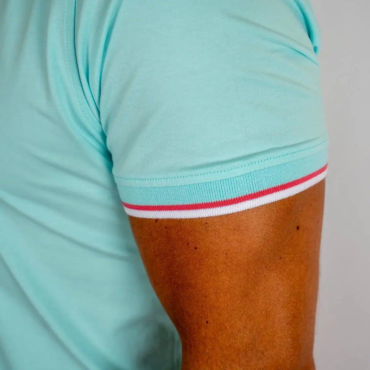 Polo homme turquoise en jersey élasthanne Blacks Legend (zoom manche)